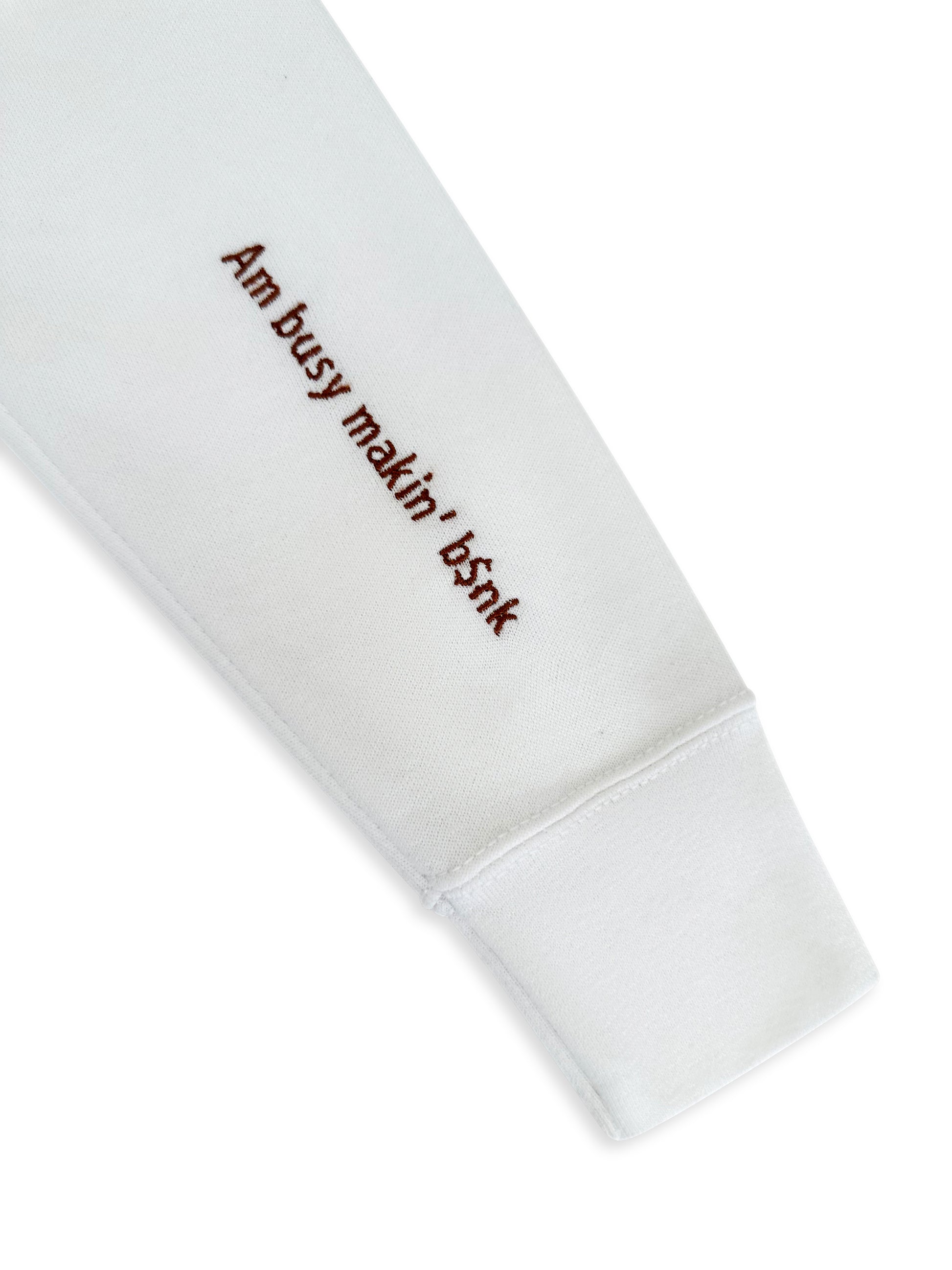 White sweatshirt with text 'Am busy makin' b$nk' on a white background. custom-branded embroidery
no minimum order embroidery
free logo setup apparel
personalized business embroidery
family-owned custom embroidery shop