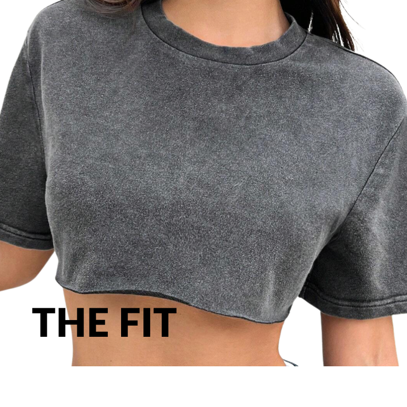 Gray crop top worn by a person with 'THE FIT' text on a white background