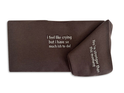 Brown fabric with printed text on a white background. handcrafted embroidered apparel
cozy embroidered crewnecks
unique embroidered accessories
bookish embroidery designs
pet-themed embroidered tees
made-to-order embroidered gifts