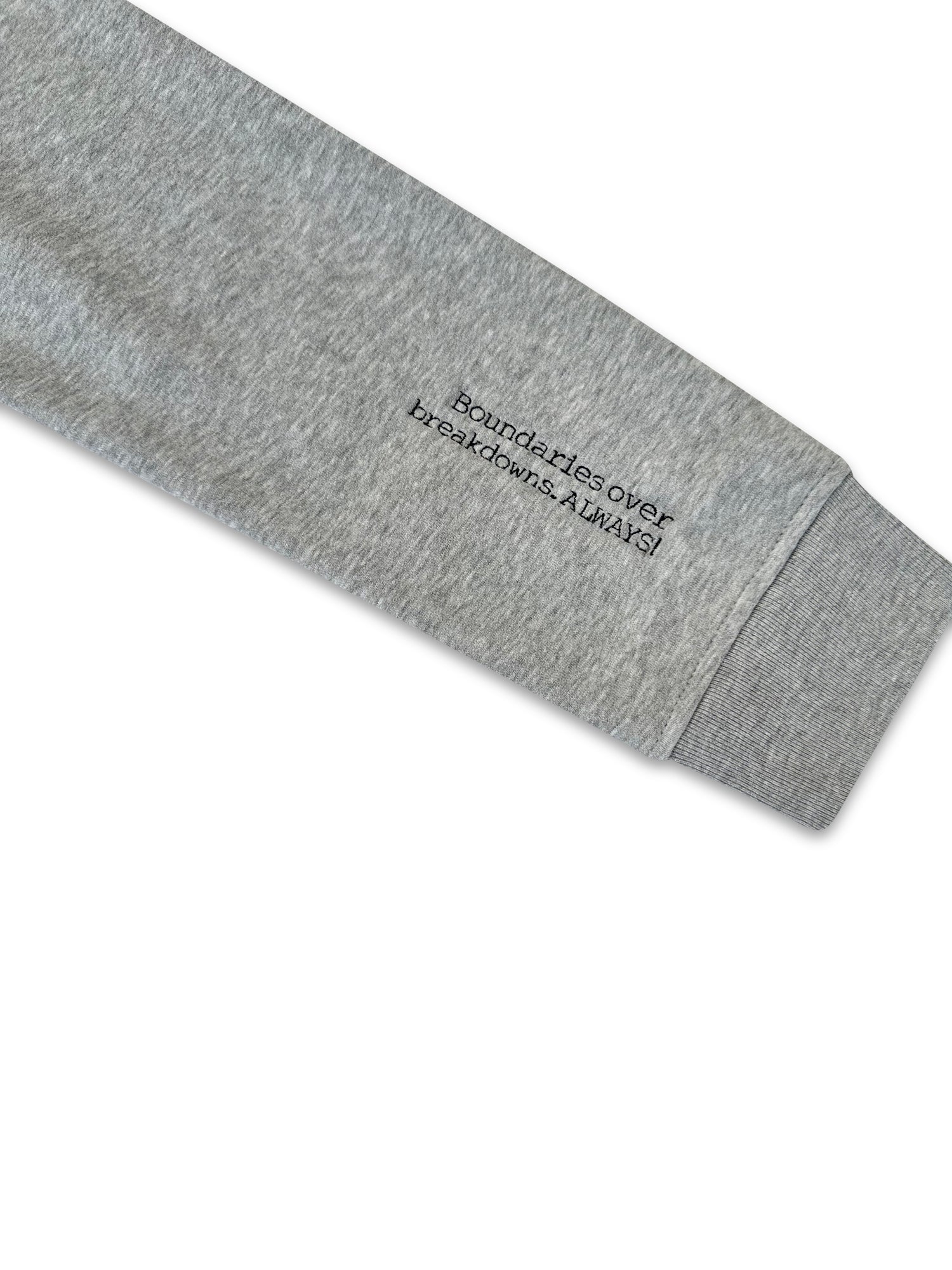 Gray sweatshirt sleeve with text on a white background. inclusive sizes embroidered apparel
oversized unisex embroidered hoodies
mental health message clothing
worldwide shipping embroidered garments
empowering embroidered clothing
fleece
